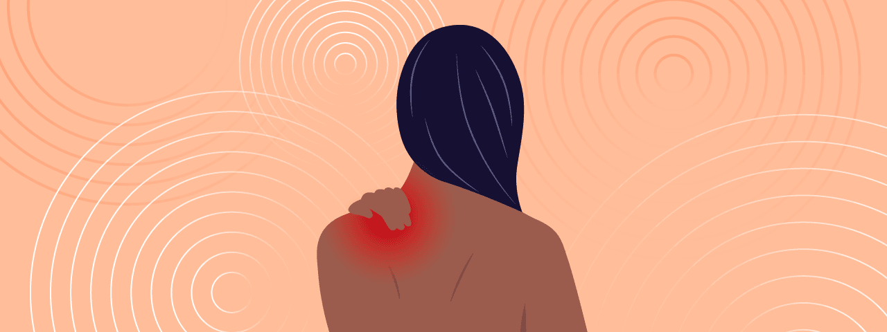 Picture of the top half of a person with long hair from behind, holding a red sore spot on their shoulder. Representing chronic pain.