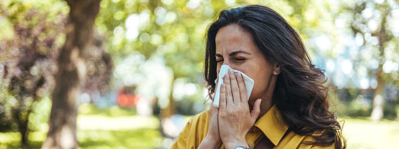 A woman sneezing